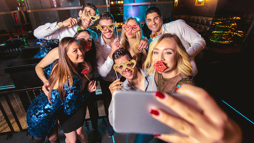 guests taking a group selfie